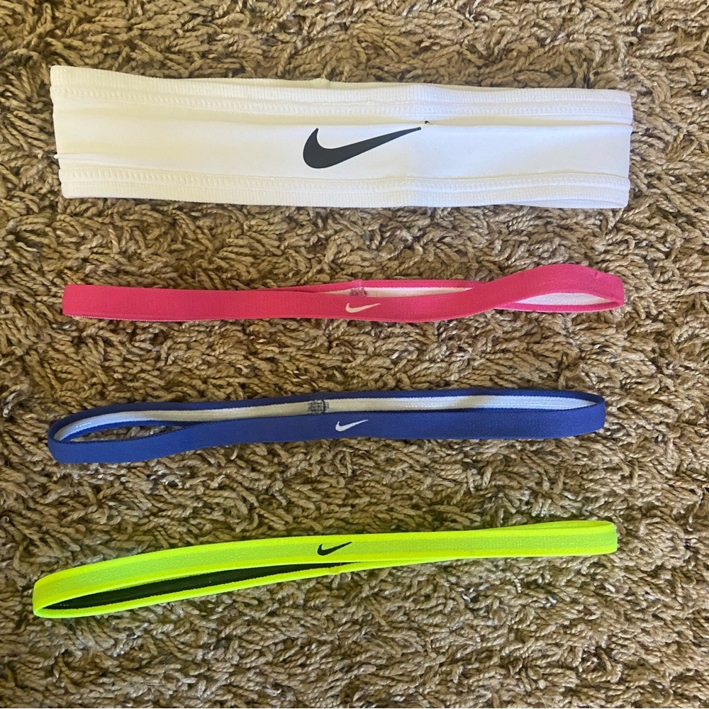 Nike headbands 4 pack of white, pink, blue, and neon yellow